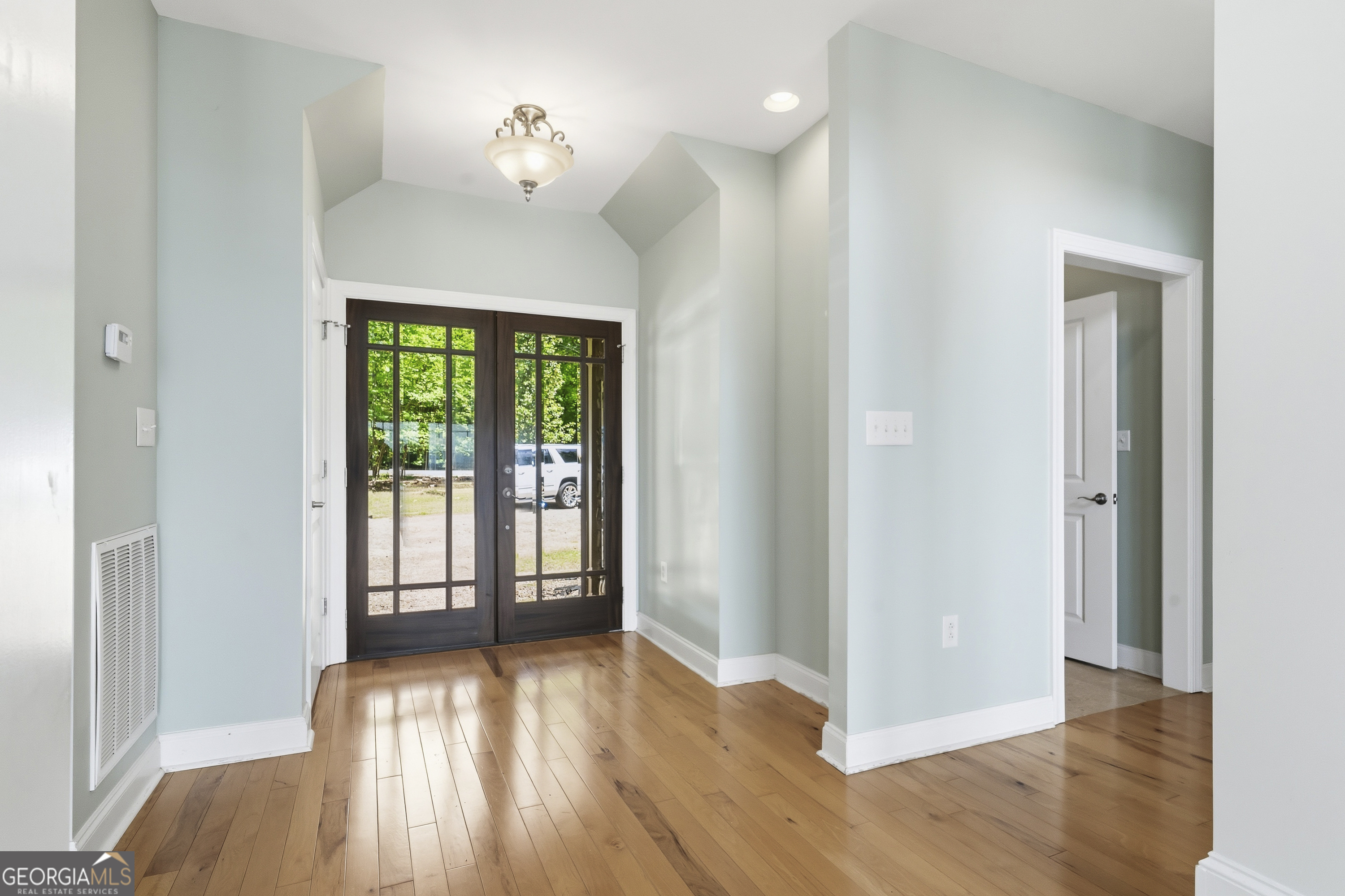 1038 Dennis Station Road Southwest Eatonton, GA 31024 - Photo 26 of 72 a view of a room with wooden floor and a window