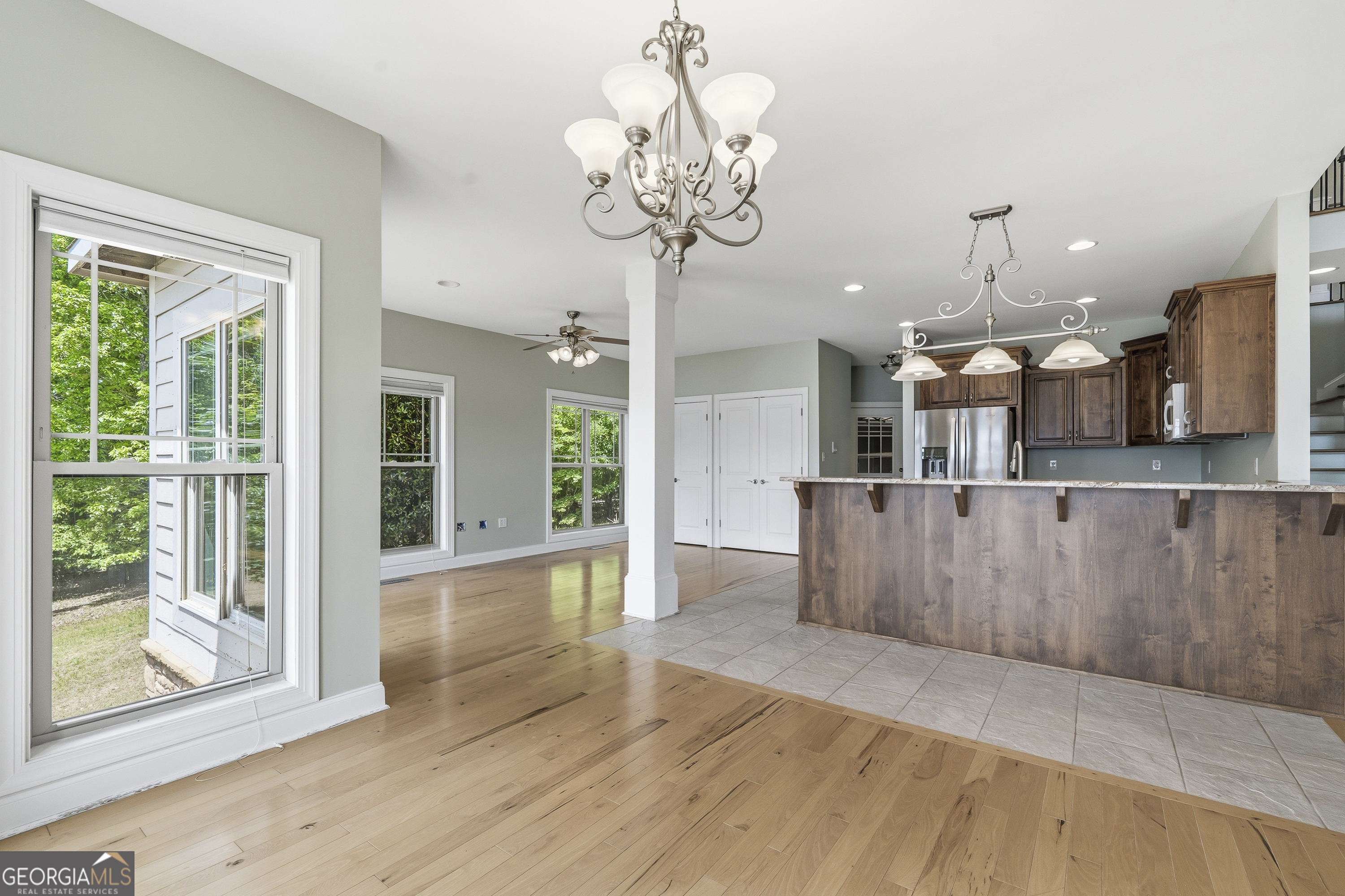 1038 Dennis Station Road Southwest Eatonton, GA 31024 - Photo 29 of 72 a view of a room with wooden floor and chandelier