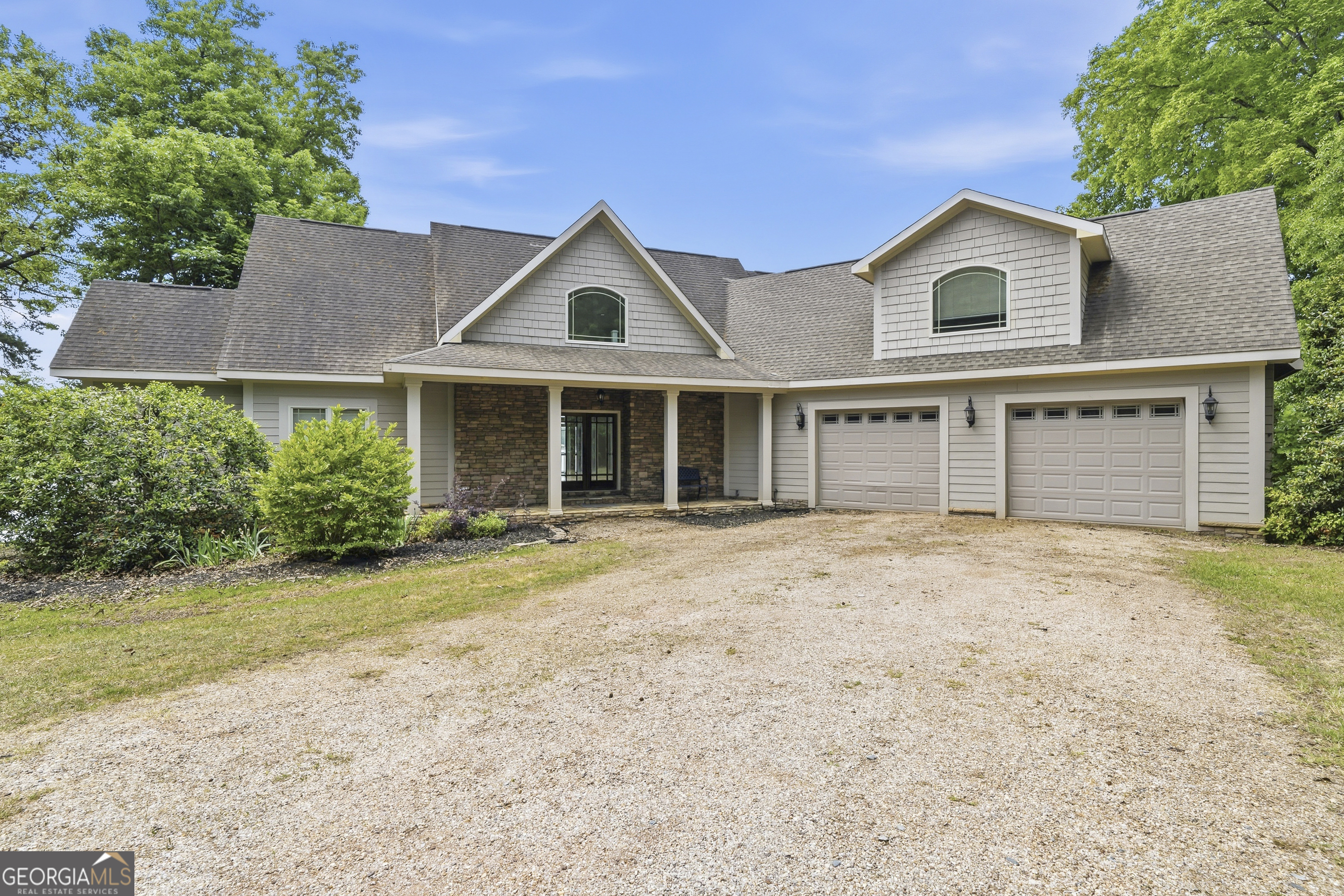 1038 Dennis Station Road Southwest Eatonton, GA 31024 - Photo 3 of 72 front view of a house with a yard