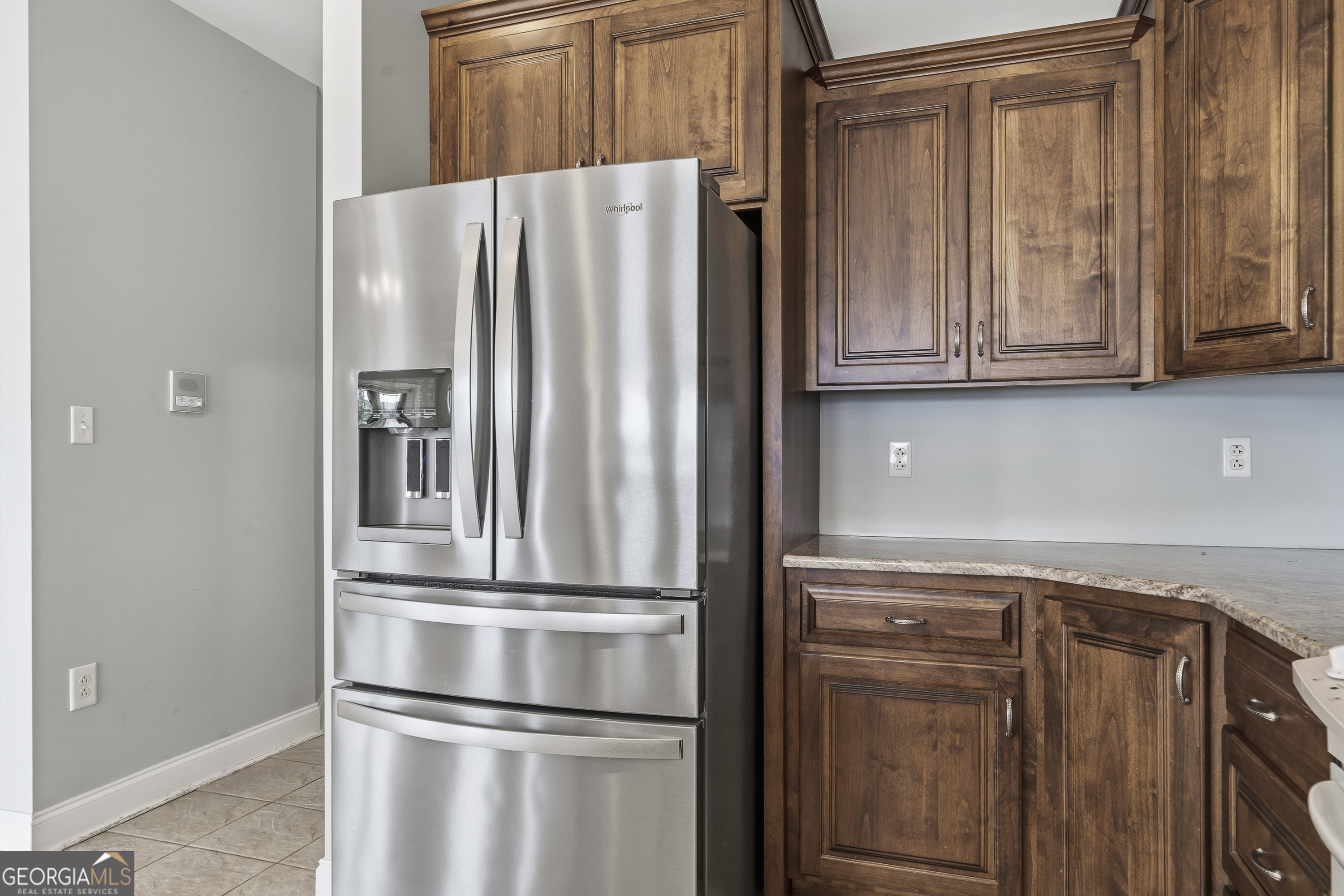 1038 Dennis Station Road Southwest Eatonton, GA 31024 - Photo 36 of 72 a view of kitchen with refrigerator and cabinet