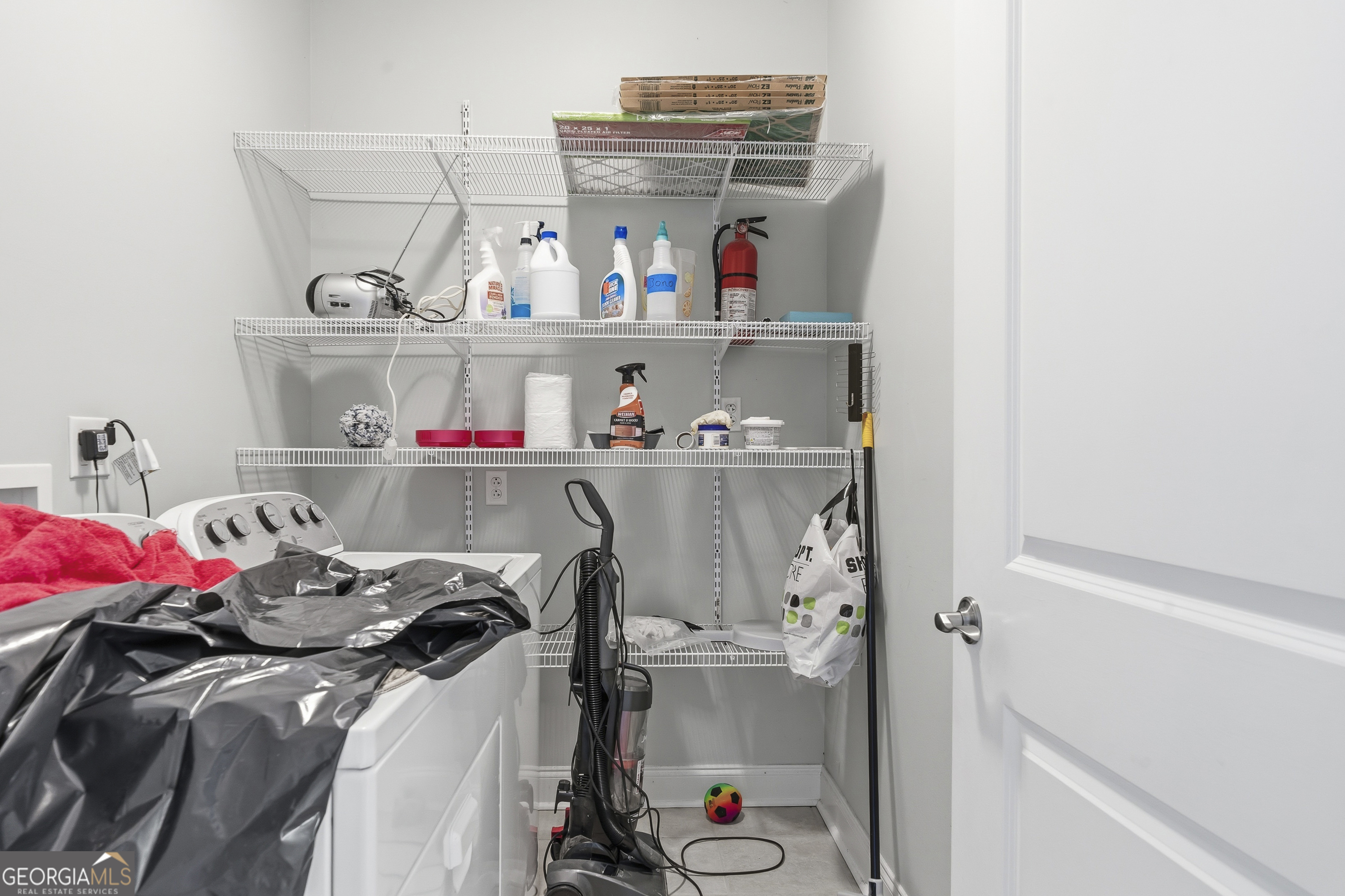 1038 Dennis Station Road Southwest Eatonton, GA 31024 - Photo 37 of 72 a view of walk in closet with clothes and shoes