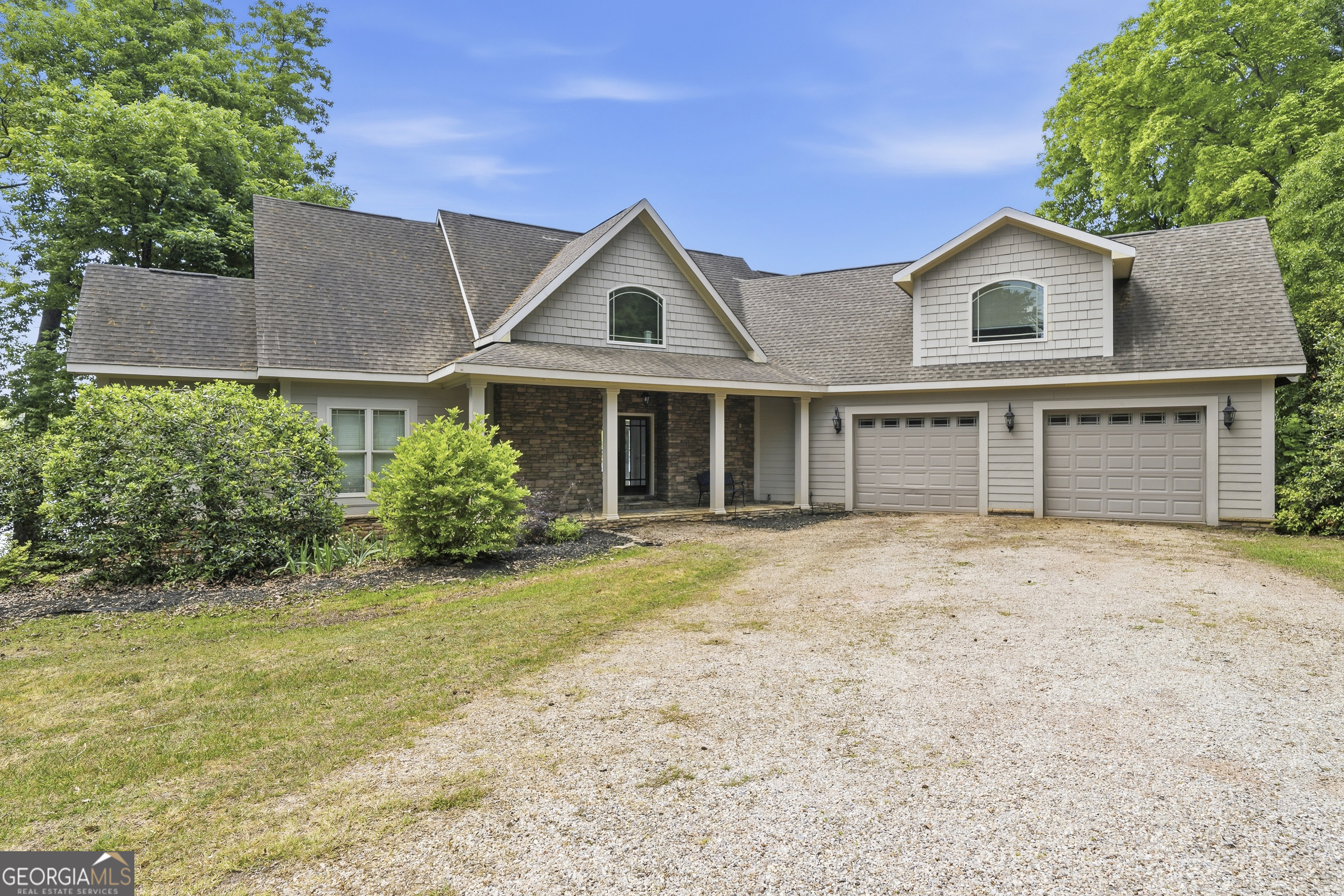 1038 Dennis Station Road Southwest Eatonton, GA 31024 - Photo 4 of 72 a house view with a garden space