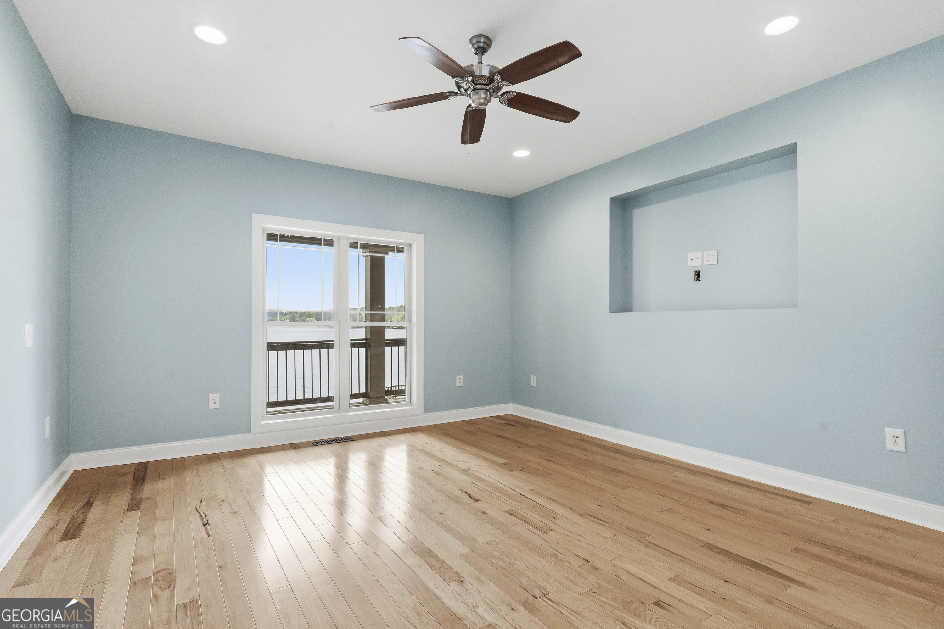1038 Dennis Station Road Southwest Eatonton, GA 31024 - Photo 41 of 72 wooden floor in an empty room with a window