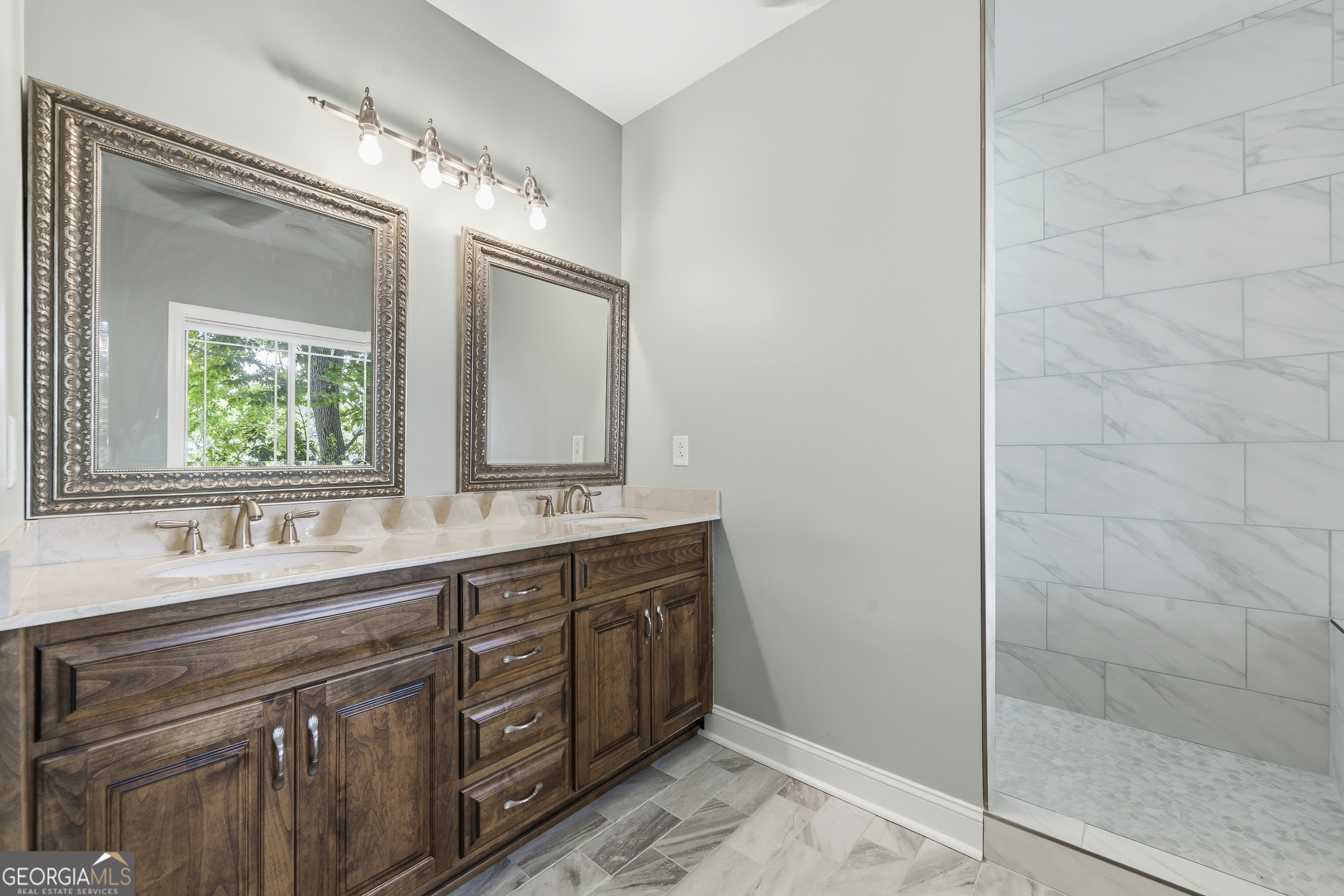 1038 Dennis Station Road Southwest Eatonton, GA 31024 - Photo 45 of 72 a bathroom with a double vanity sink mirror and double
