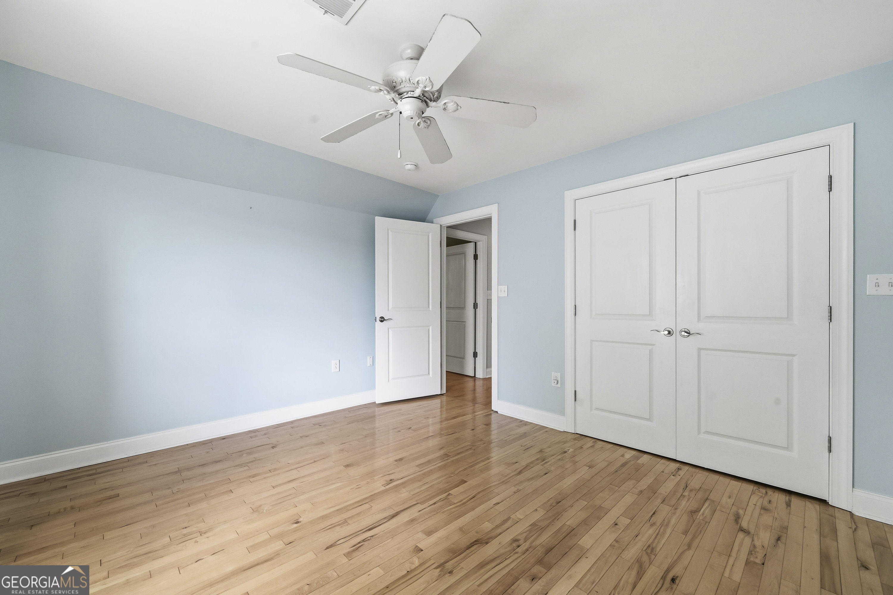 1038 Dennis Station Road Southwest Eatonton, GA 31024 - Photo 55 of 72 a view of an empty room with wooden floor
