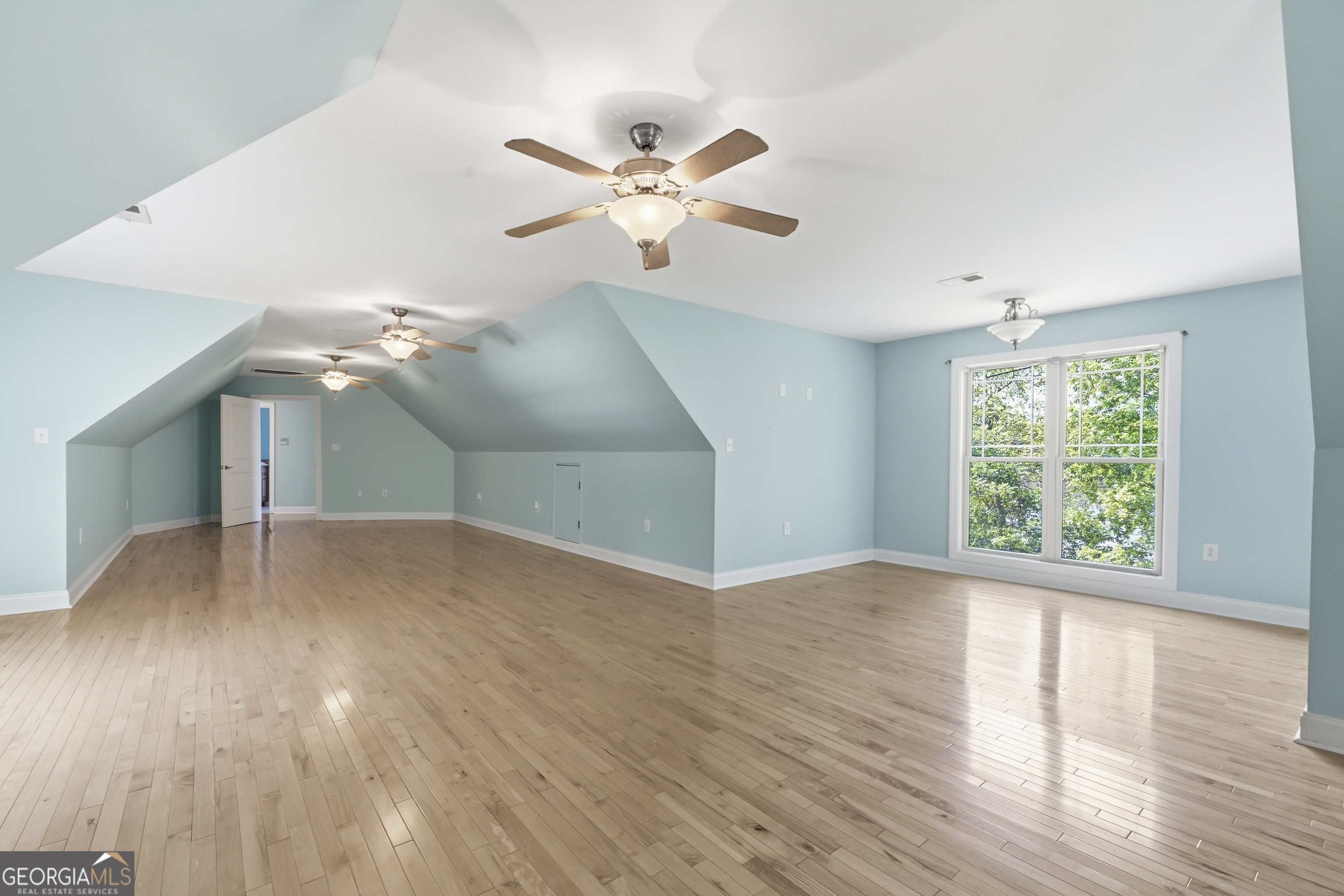 1038 Dennis Station Road Southwest Eatonton, GA 31024 - Photo 57 of 72 a view of a livingroom with a ceiling fan and window