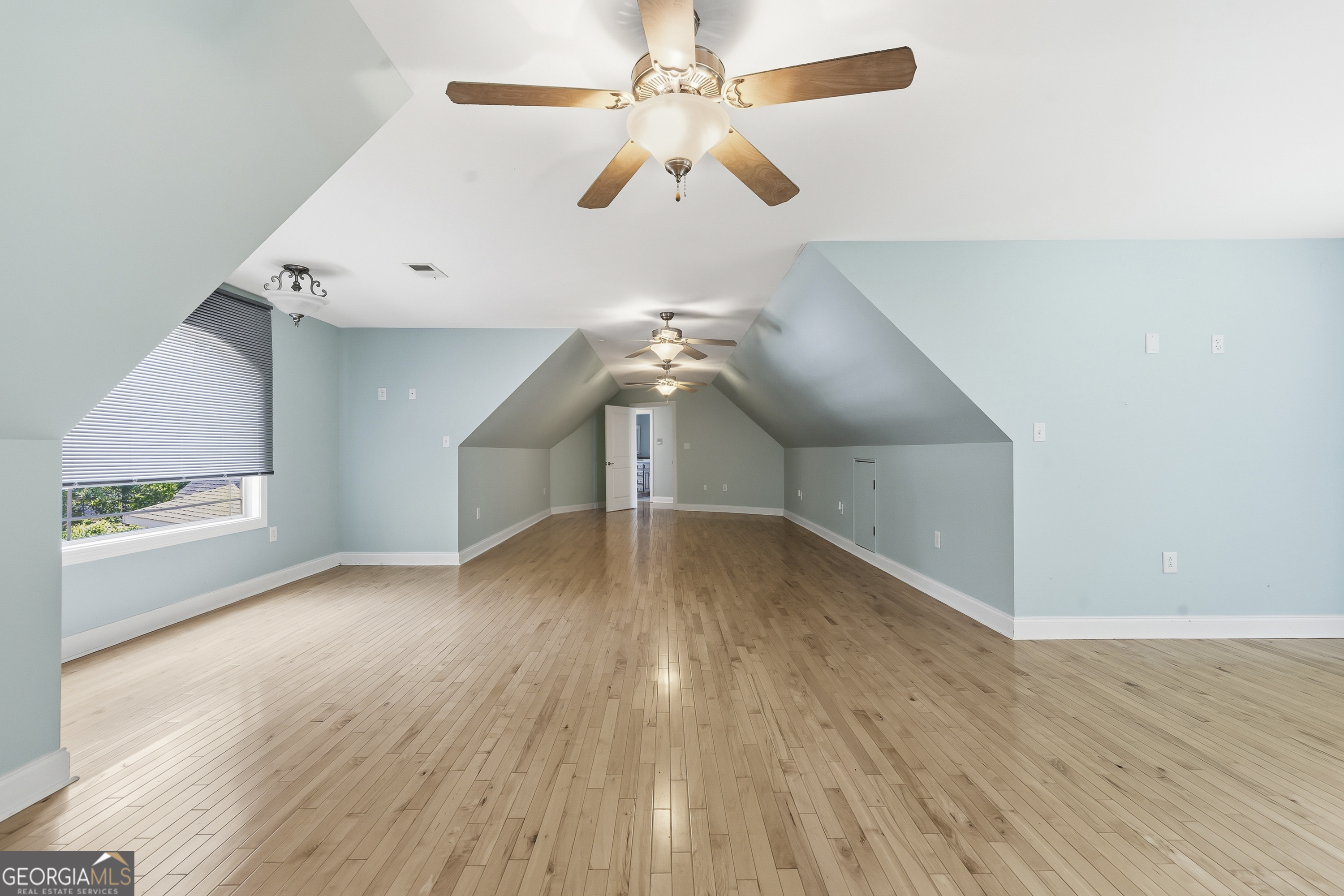 1038 Dennis Station Road Southwest Eatonton, GA 31024 - Photo 58 of 72 wooden floor in an empty room with a window