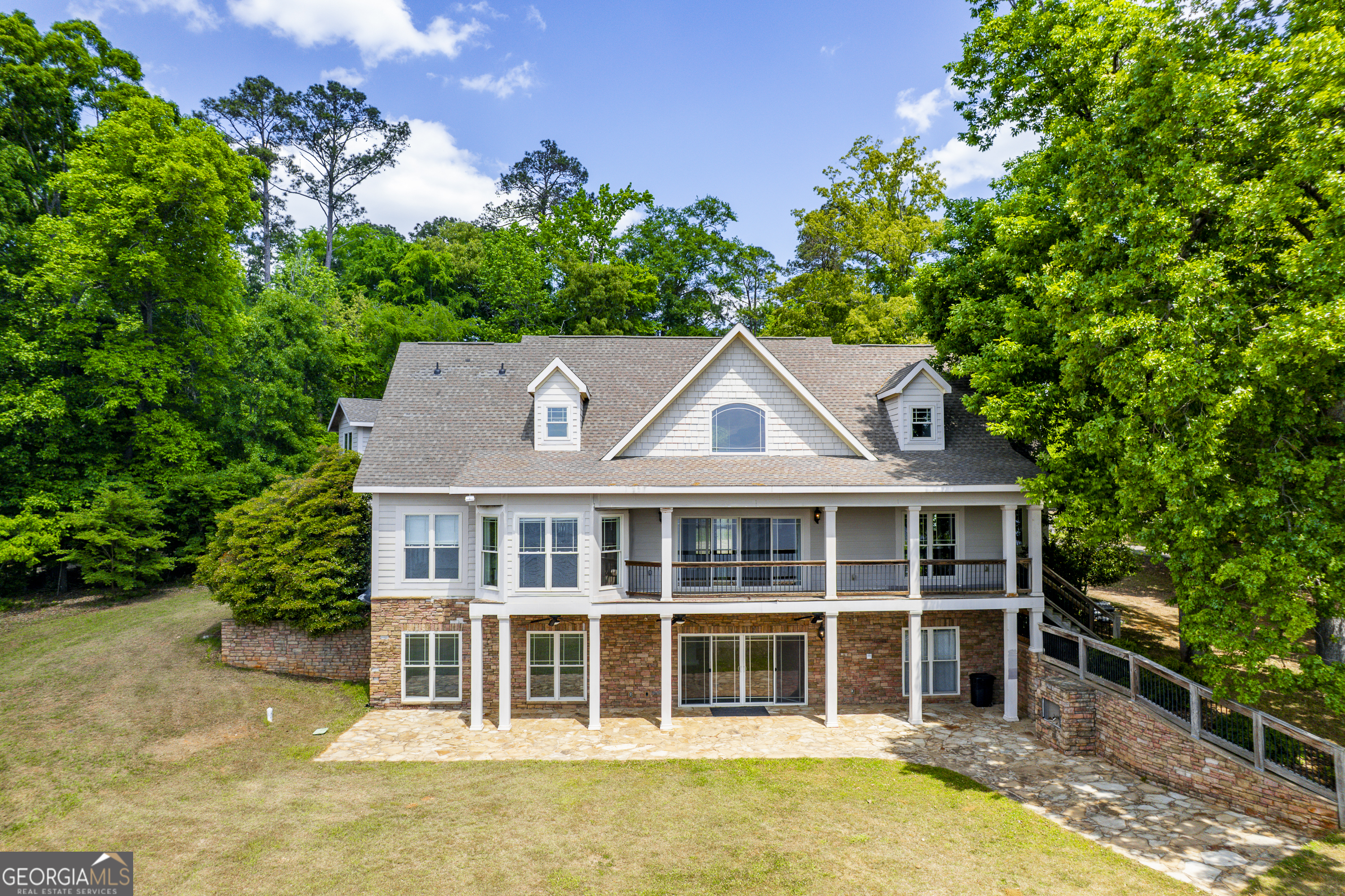 1038 Dennis Station Road Southwest Eatonton, GA 31024 - Photo 7 of 72 front view of a house with a yard
