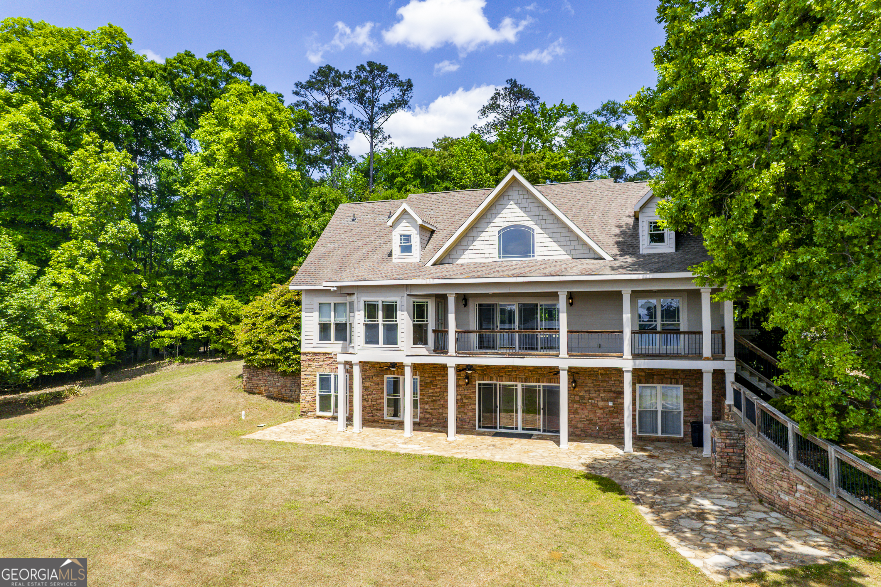 1038 Dennis Station Road Southwest Eatonton, GA 31024 - Photo 8 of 72 a front view of a house with a garden