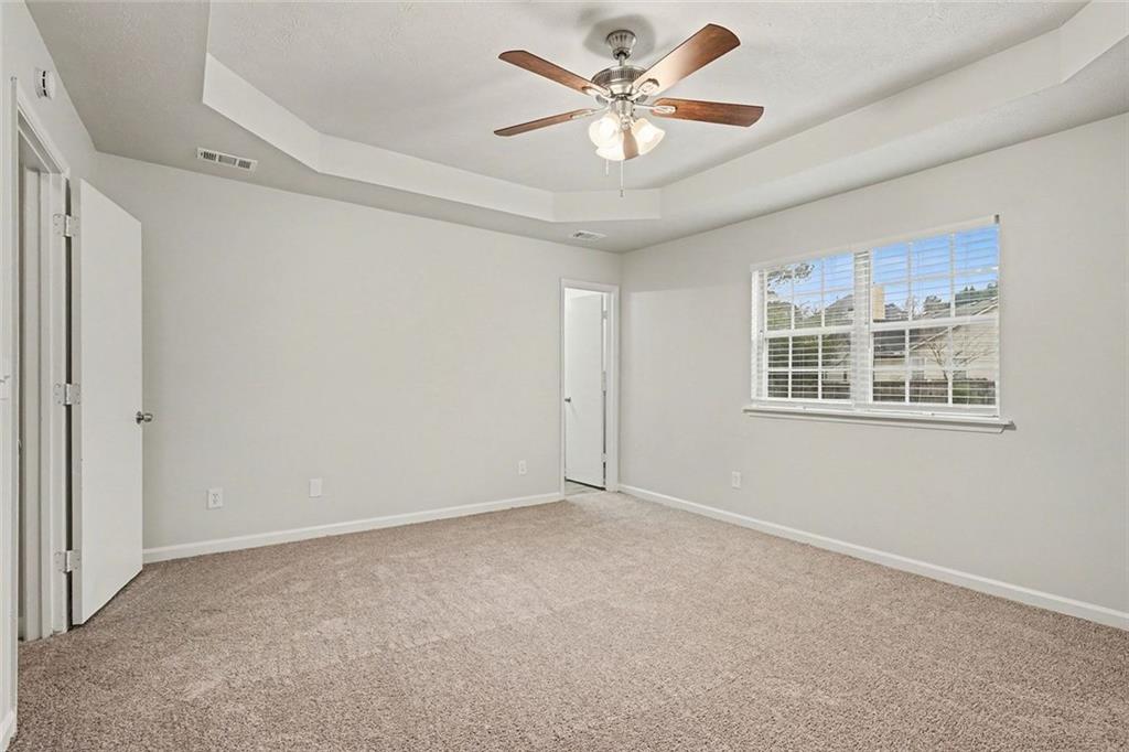 5571 Tunbridge Wells Road Lithonia, GA 30058 - Photo 11 of 23 a view of an empty room with a window