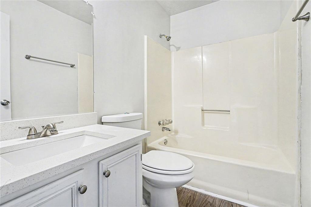 5571 Tunbridge Wells Road Lithonia, GA 30058 - Photo 12 of 23 a bathroom with a sink a toilet and shower