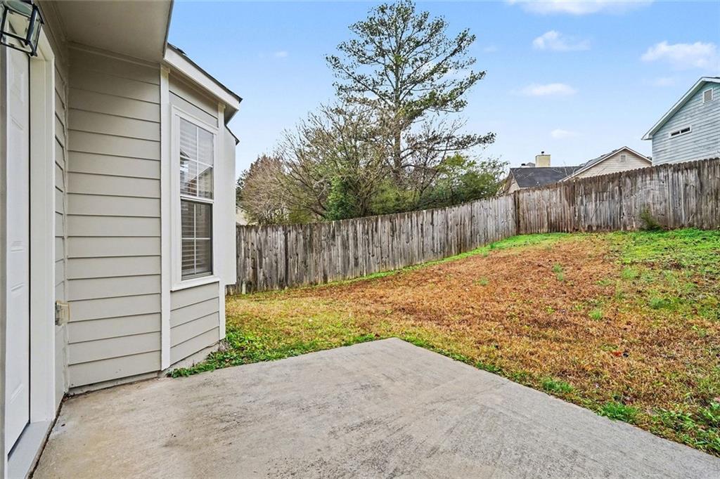 5571 Tunbridge Wells Road Lithonia, GA 30058 - Photo 22 of 23 a backyard of a house