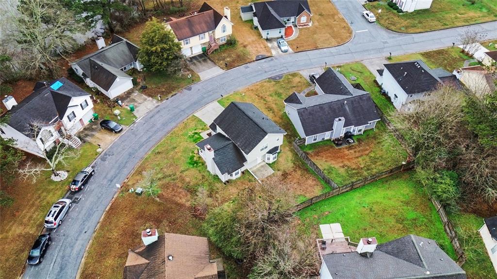5571 Tunbridge Wells Road Lithonia, GA 30058 - Photo 23 of 23 an aerial view of a house with a swimming pool