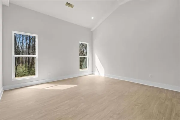 an empty room with closet area