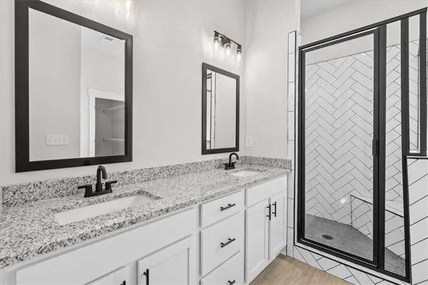 a bathroom with a bathtub and shower