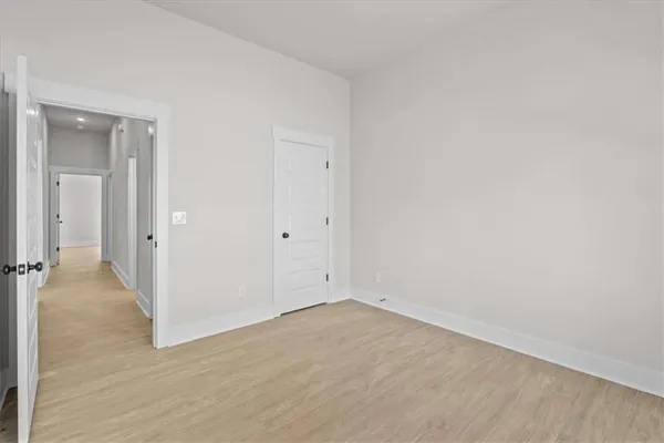 a bathroom with a granite countertop sink mirror and a bathtub