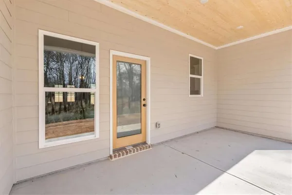 a view of backyard space and tree