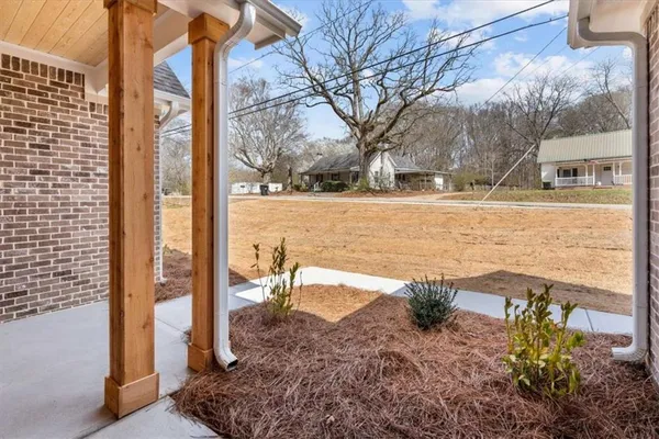 a view of a yard with a tree