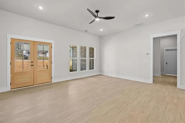 a view of an empty room with a window
