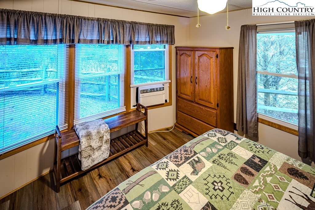 135 Mountain Ivy Lane Boone, NC 28607 - Photo 26 of 29 a living room with a bed furniture and a window