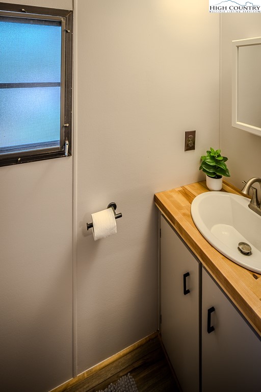 135 Mountain Ivy Lane Boone, NC 28607 - Photo 27 of 29 a bathroom with a sink and mirror