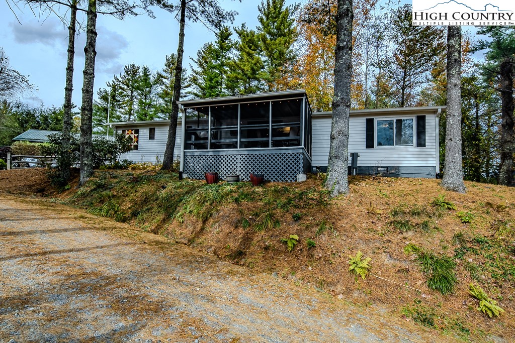 135 Mountain Ivy Lane Boone, NC 28607 - Photo 28 of 29 a front view of a house with a garden