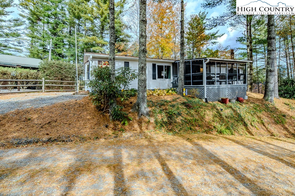 135 Mountain Ivy Lane Boone, NC 28607 - Photo 7 of 29 front view of a house with a yard