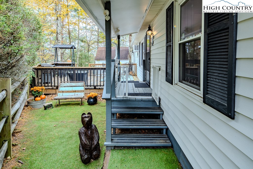 135 Mountain Ivy Lane Boone, NC 28607 - Photo 8 of 29 a backyard of a house with seating space