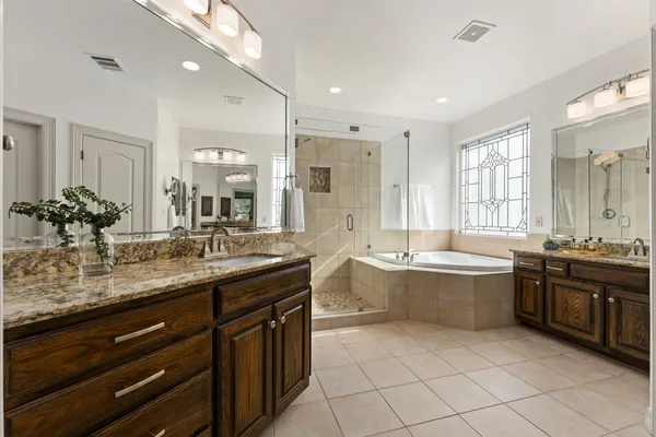 a bedroom with furniture and windows
