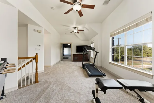 a very nice looking room with a large window and a chandelier