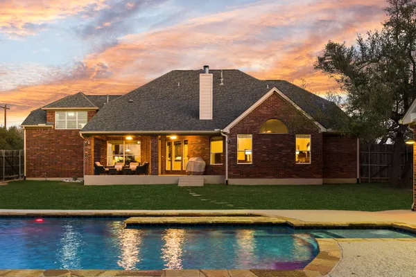 a view of a patio with couches chairs and a big yard