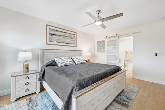 a bathroom with a toilet and a shower curtain