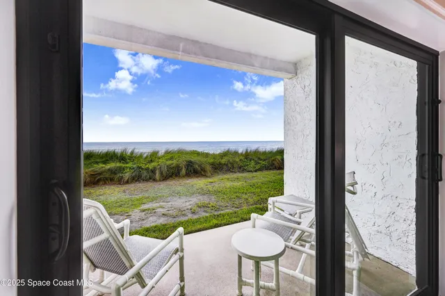 a bedroom with a large bed and a desk