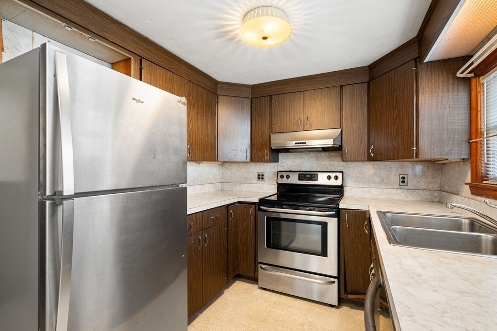 14 Hillside Road Braintree, MA 02184 - Photo 14 of 42 a kitchen with a refrigerator sink and stove