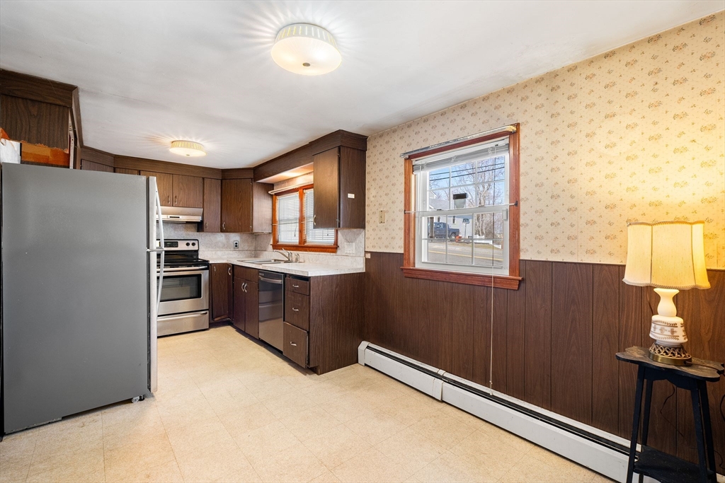 14 Hillside Road Braintree, MA 02184 - Photo 18 of 42 a kitchen with stainless steel appliances granite countertop a refrigerator sink and stove