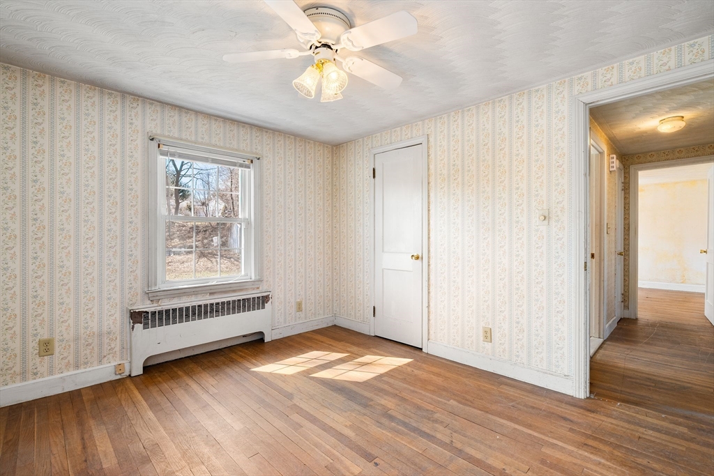 14 Hillside Road Braintree, MA 02184 - Photo 20 of 42 an empty room with wooden floor and windows