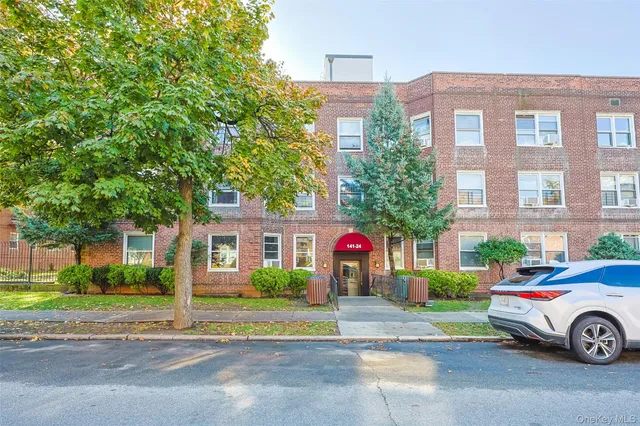a car parked in front of a brick building