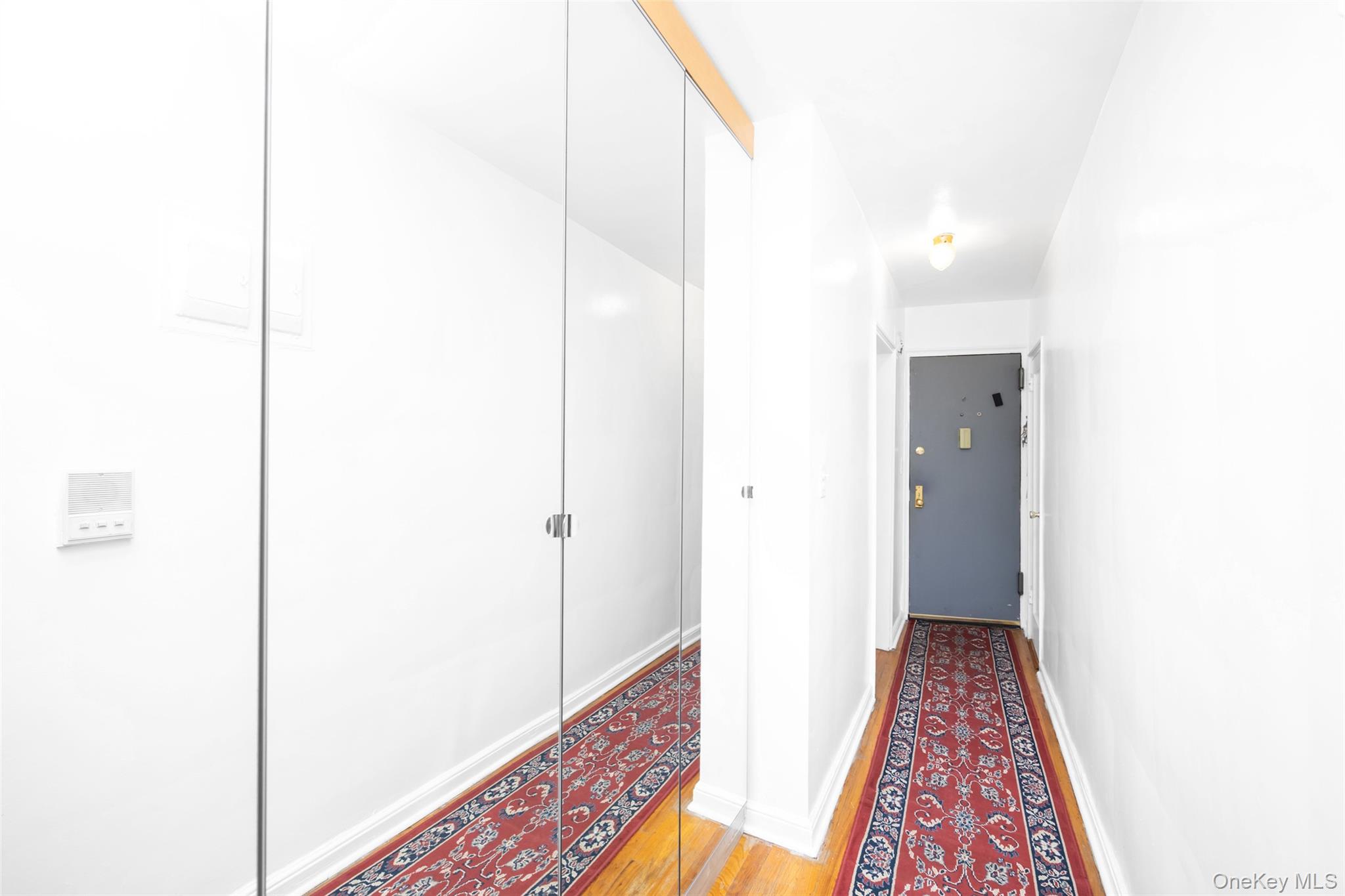 141-24 78th Road, Unit 3A Queens, NY 11367 - Photo 9 of 15 a view of hallway with wooden floor