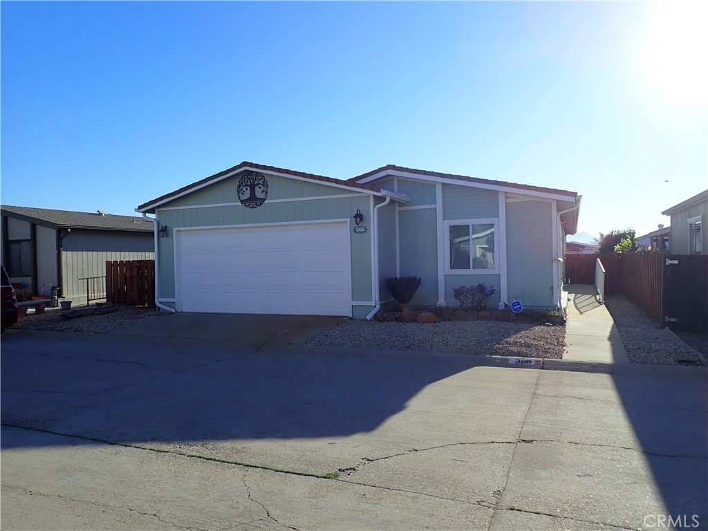 27250 Murrieta Road, Unit 386 Menifee, CA 92586 - Photo 1 of 32 a front view of a house with a yard