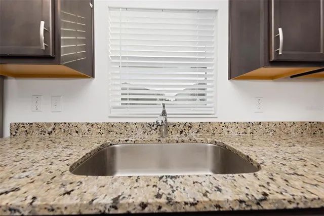 a kitchen with stainless steel appliances a refrigerator and a stove top oven
