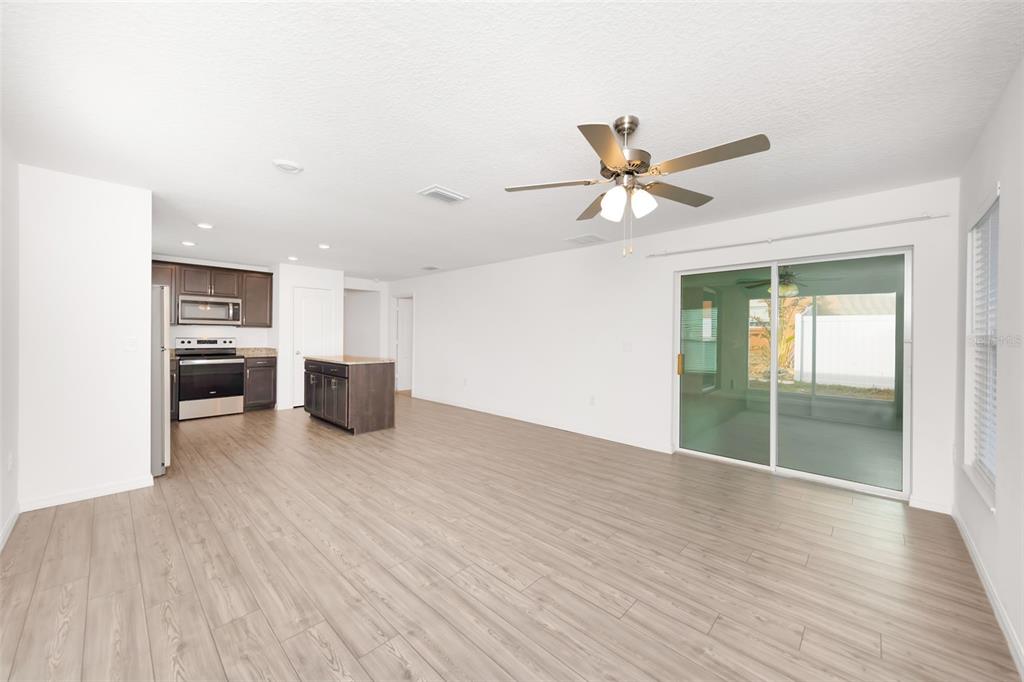 8646 Pinetop Ridge Lane Brooksville, FL 34613 - Photo 13 of 76 a view of a kitchen with a sink and a stove top oven