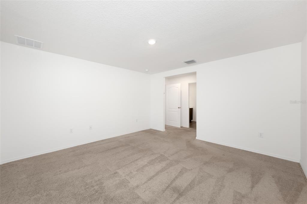 8646 Pinetop Ridge Lane Brooksville, FL 34613 - Photo 18 of 76 a view of an empty room