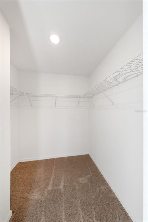 8646 Pinetop Ridge Lane Brooksville, FL 34613 - Photo 20 of 76 a view of a room with shelf