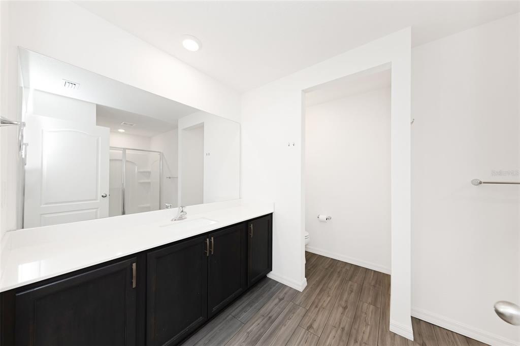 8646 Pinetop Ridge Lane Brooksville, FL 34613 - Photo 21 of 76 a bathroom with a sink and a mirror