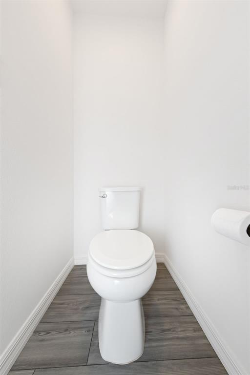 8646 Pinetop Ridge Lane Brooksville, FL 34613 - Photo 22 of 76 a bathroom with a sink and a toilet