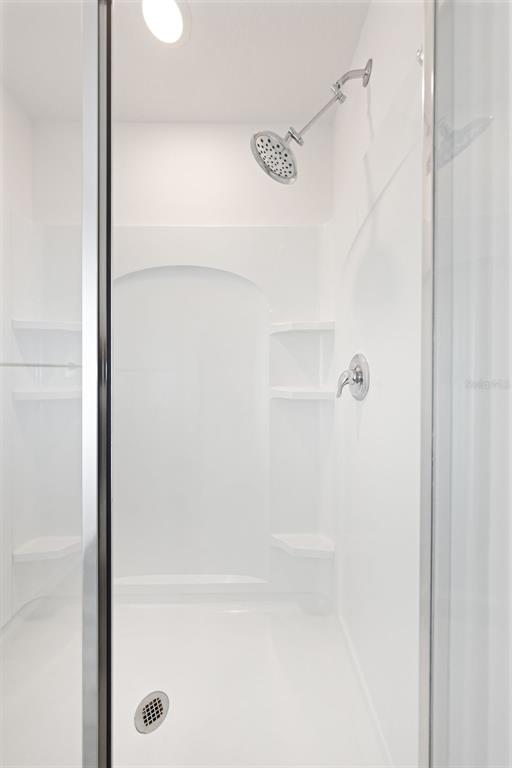 8646 Pinetop Ridge Lane Brooksville, FL 34613 - Photo 23 of 76 a close view of a bathtub in bathroom