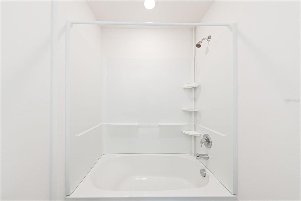 8646 Pinetop Ridge Lane Brooksville, FL 34613 - Photo 26 of 76 a close up of a bathtub