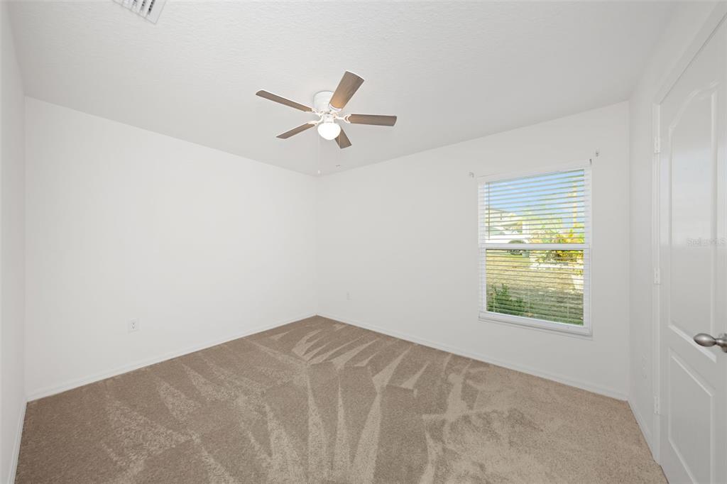 8646 Pinetop Ridge Lane Brooksville, FL 34613 - Photo 28 of 76 a view of a big room with carpet