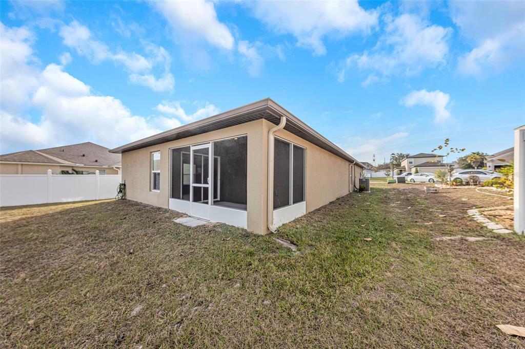 8646 Pinetop Ridge Lane Brooksville, FL 34613 - Photo 40 of 76 a view of a house with backyard and garden