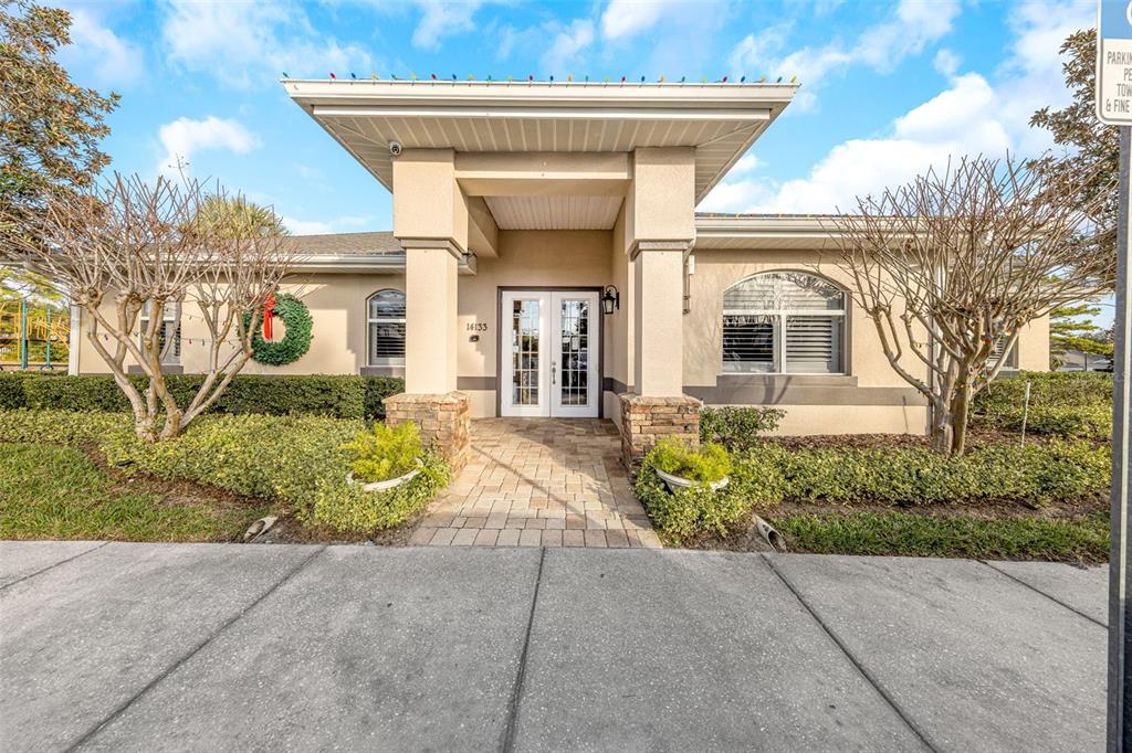 8646 Pinetop Ridge Lane Brooksville, FL 34613 - Photo 54 of 76 a view of a house with potted plants